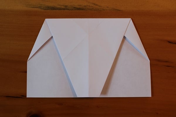 Top half folded down to meet bottom edge.